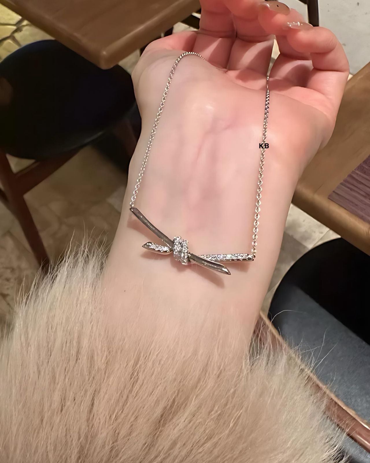 TIFFANY KNOT PENDANT IN SILVER WITH DIAMONDS