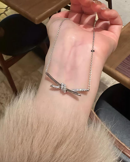 TIFFANY KNOT PENDANT IN SILVER WITH DIAMONDS