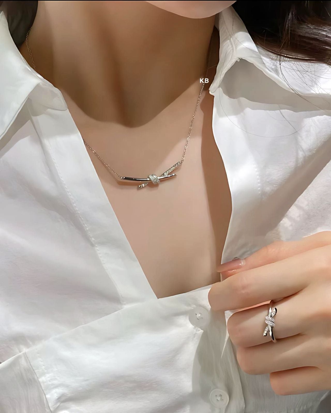 TIFFANY KNOT PENDANT IN SILVER WITH DIAMONDS